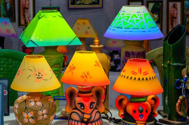 Different types of handmade illuminated table lamp displayed in a handicraft fair.