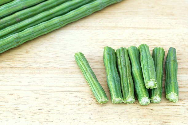 Ciut pieces of Moringa on a cutting board